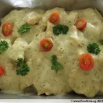 Grilled Dory with Pesto Cream topped with Parsley and Sliced Cherry Tomatoes