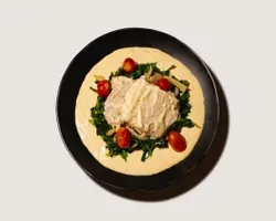 Tuscan Garlic Cream White Fish<br> Traditional garlic cream sauce, baked white fish, roasted tomatoes | Customer Photo | Grain