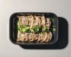 Steamed Plant-based Gyoza<br>poached garlic, spring onion,black sesame seed, light malasoy dipping | Customer Photo | Grain