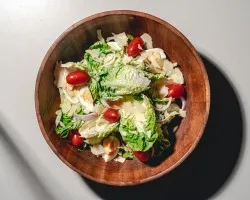 The Classic Caesar Salad<br> Romaine lettuce, croutons, shaved parmesan flakes, cherry tomatoes, housemade caesar dressing<br> Vegetarian, Contains wheat, dairy, soy, egg and allium | Customer Photo | Grain