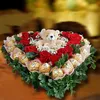 Click to see more photos of RR048: 12 Red Roses & 22 Rochers Table Arrangement